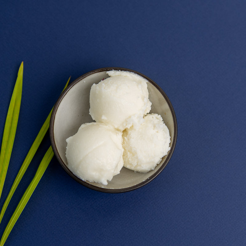 Smooth refined shea butter with a neutral white appearance