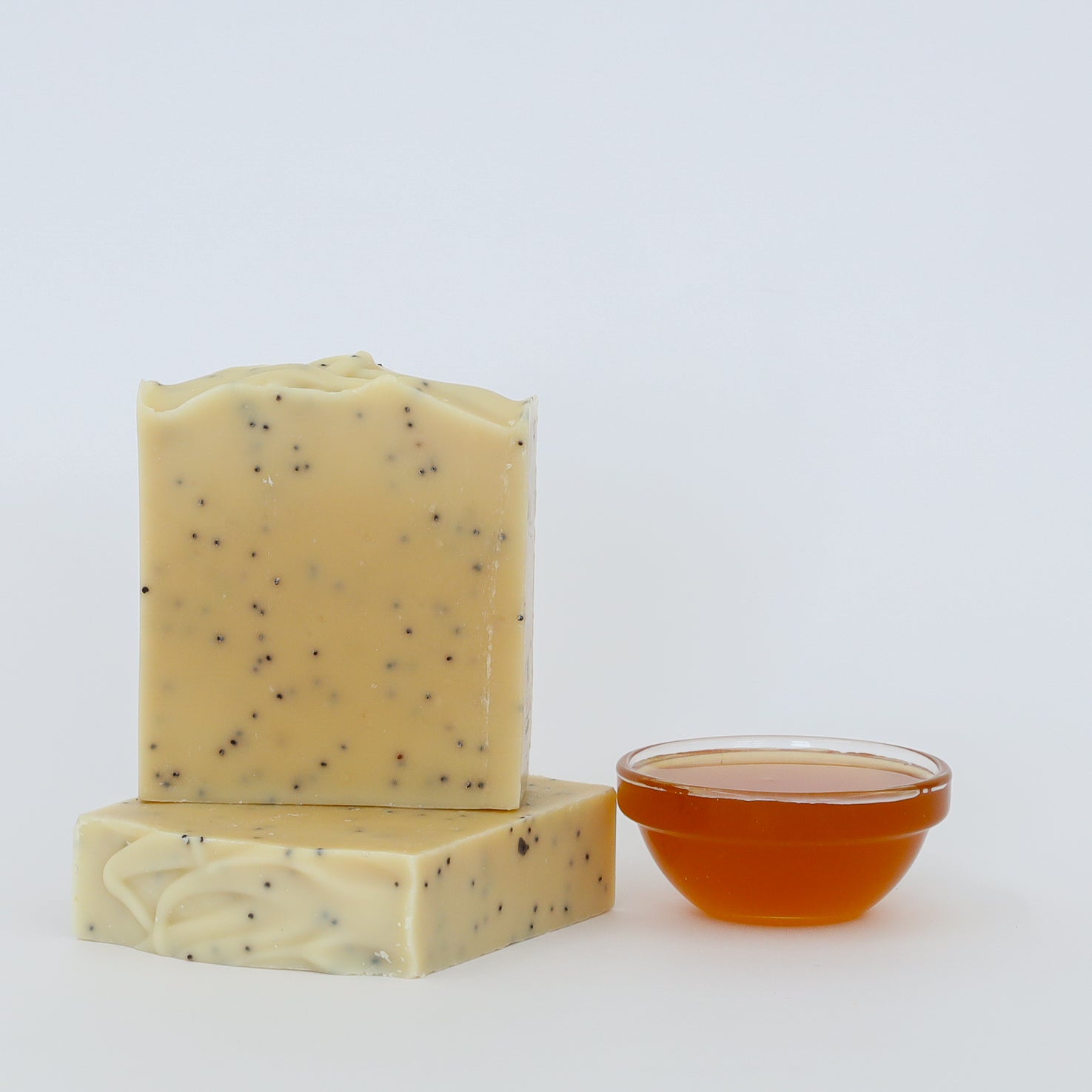 Lemon and honey handmade scrub soap with exfoliating poppy seeds and raw honey