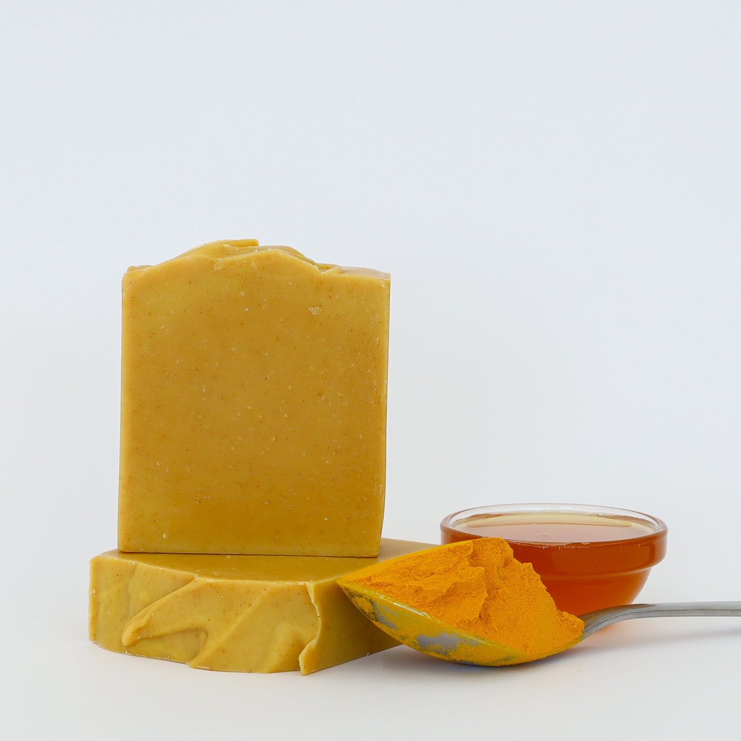 Handmade turmeric, honey and ginger cold process soap with natural ingredients and golden colour