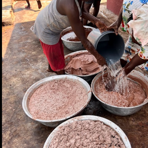 Traditional production of Unrefined Shea Butter in Ghana using time-honoured methods.